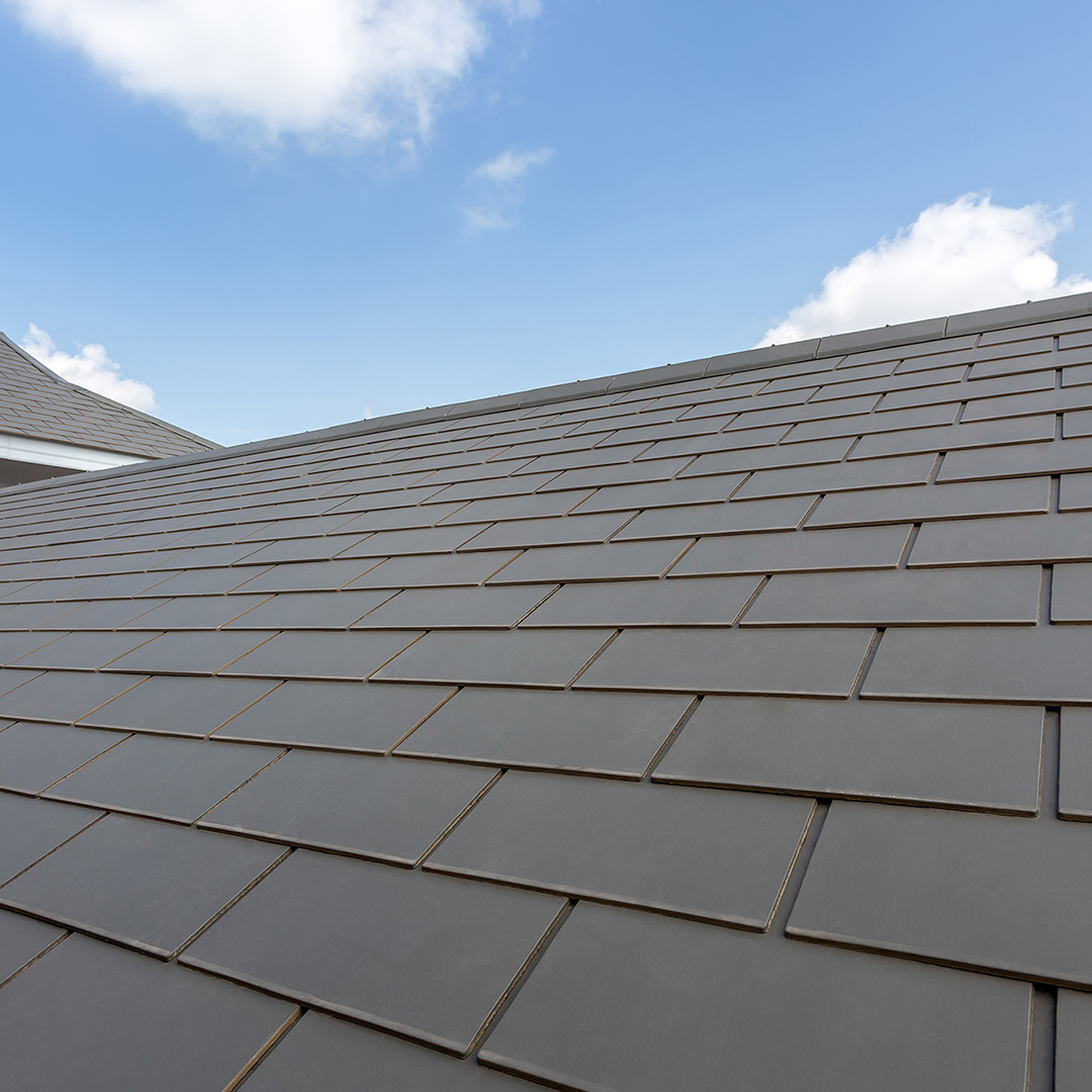 A well constructed roof made from grey tiles