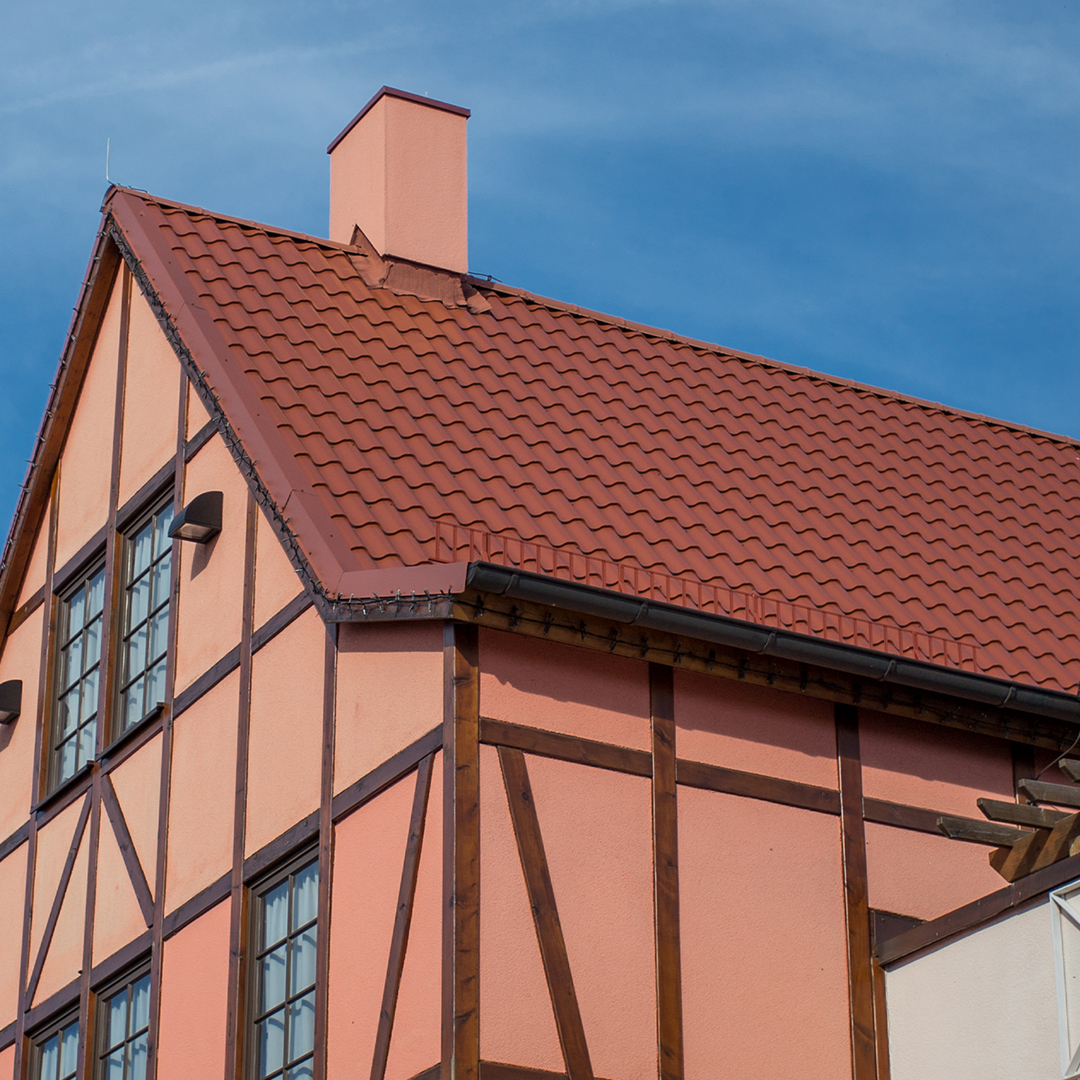 A pretty home constructed with a roof made from slate material