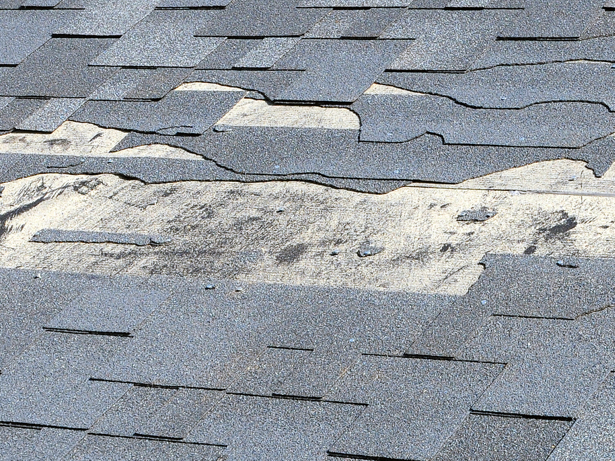 Image of a roof with missing shingles