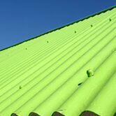 Corrugated metal roofing panels are a great fit for sheds and other garden structures.